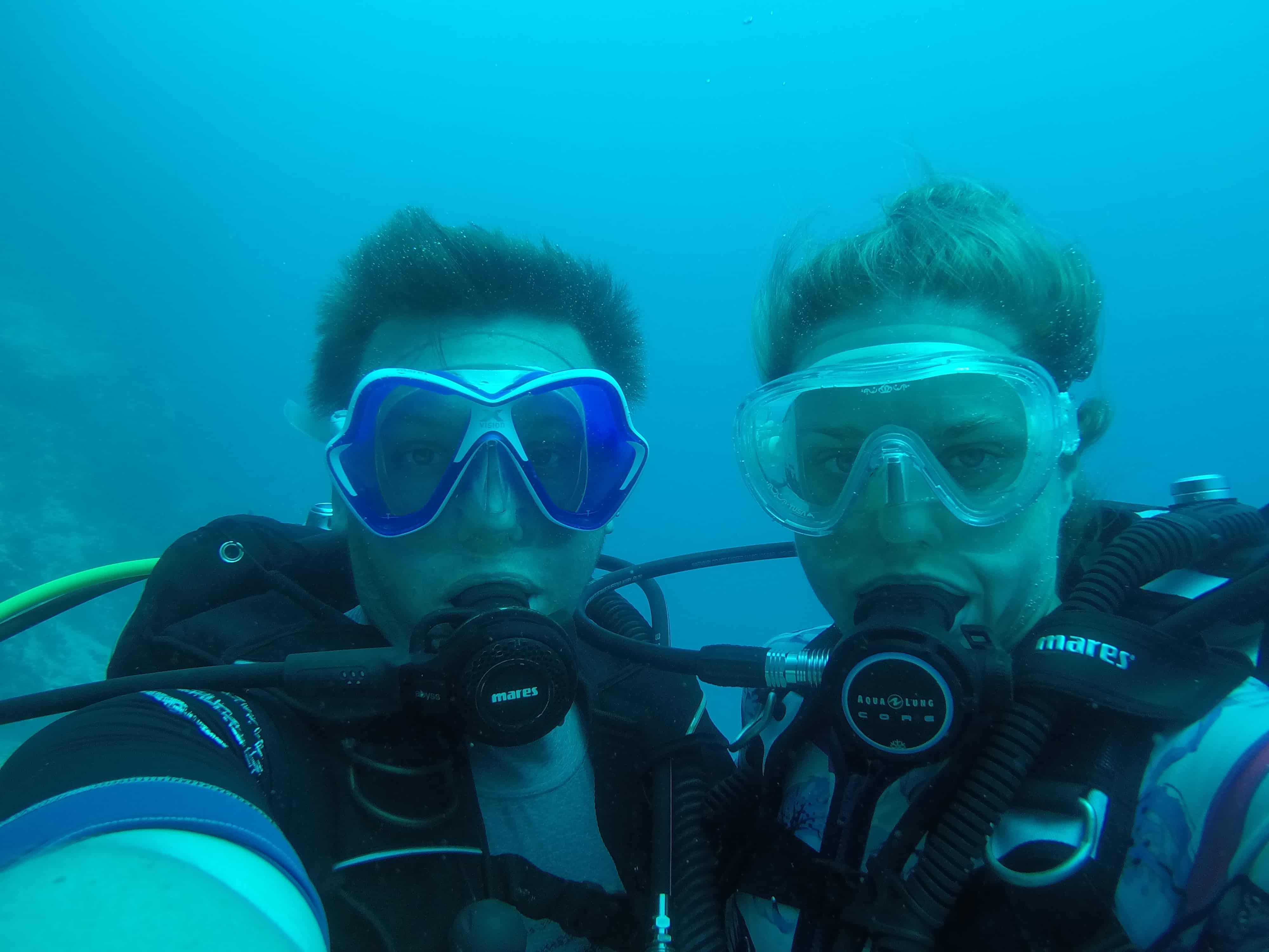 Neil Mostyn and partner diving underwater — The Dive Brief